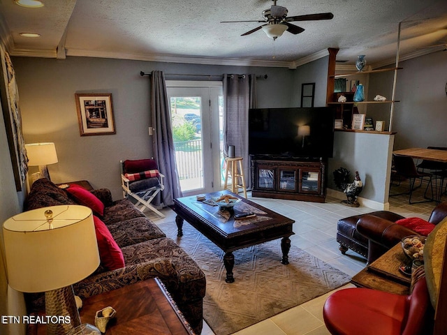 tiled living area with ceiling fan, ornamental molding, and a textured ceiling