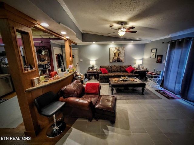 living room featuring a textured ceiling, ceiling fan, and crown molding