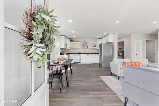 dining area featuring dark wood-style floors and recessed lighting