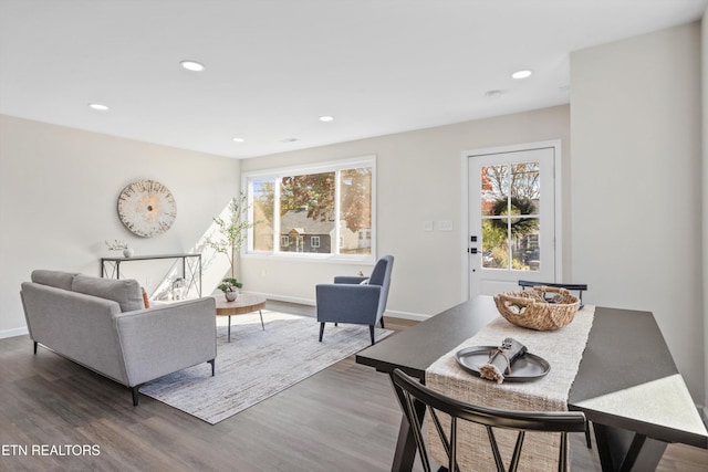 living room with recessed lighting, baseboards, and wood finished floors