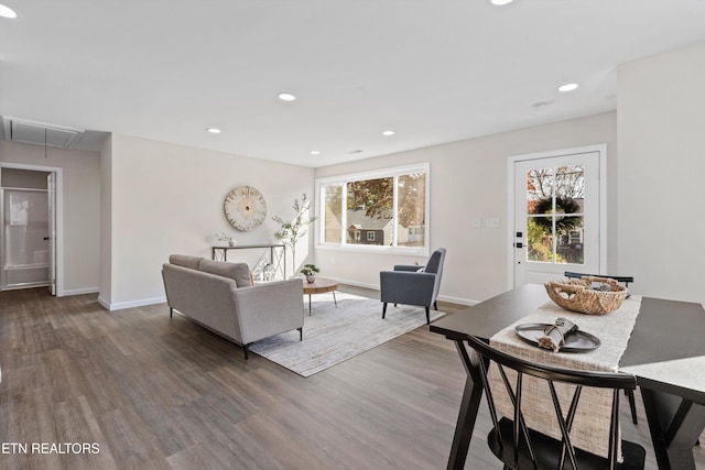 living area featuring recessed lighting, visible vents, attic access, wood finished floors, and baseboards