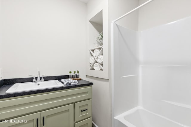 bathroom with shower / washtub combination and vanity