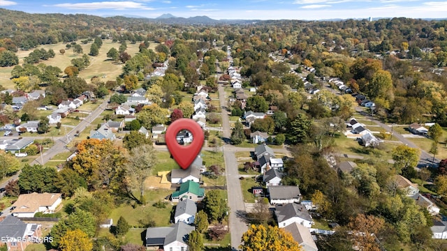 birds eye view of property with a residential view