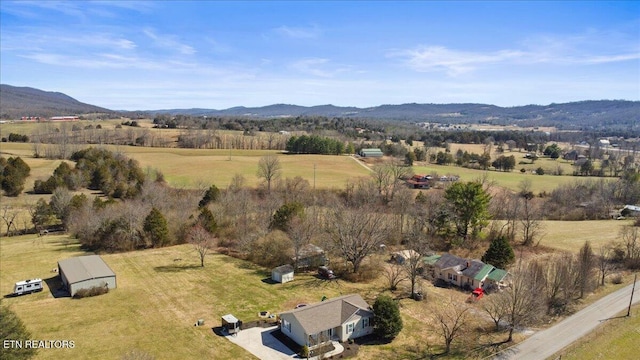 aerial view with a mountain view and a rural view