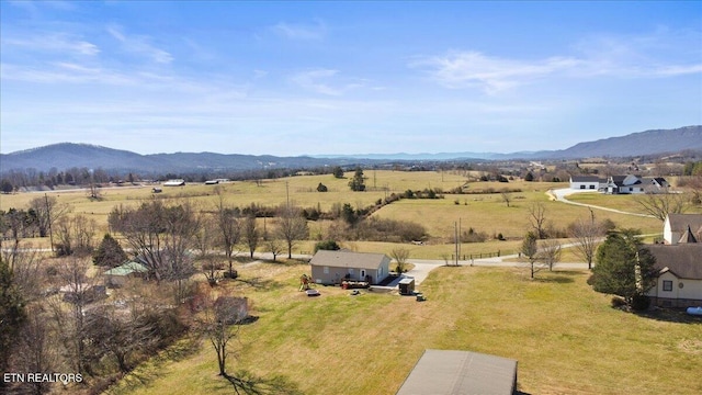 drone / aerial view featuring a mountain view and a rural view