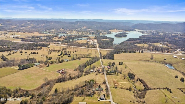 birds eye view of property with a water view and a rural view