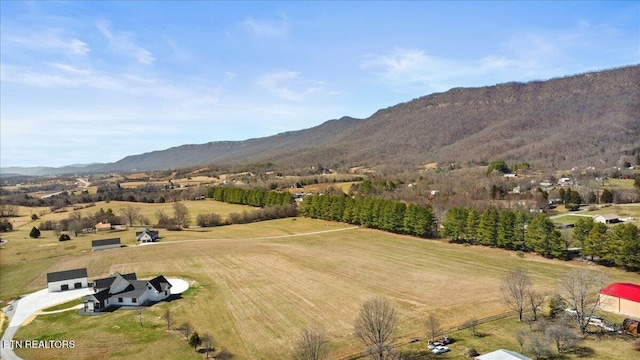 aerial view with a mountain view and a rural view