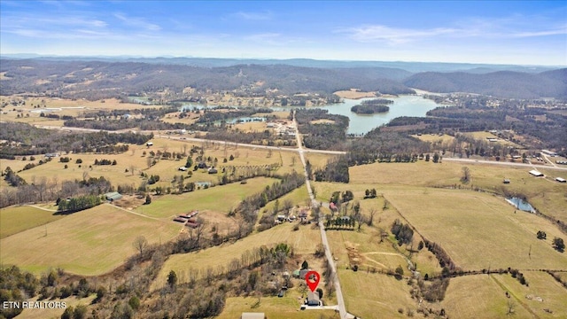 birds eye view of property featuring a rural view and a water view