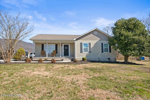 single story home featuring covered porch and a front lawn