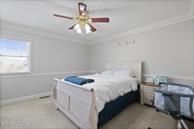 bedroom featuring light carpet, a textured ceiling, visible vents, and crown molding