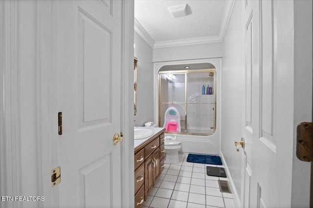 full bath featuring a textured ceiling, vanity, combined bath / shower with glass door, tile patterned floors, and crown molding