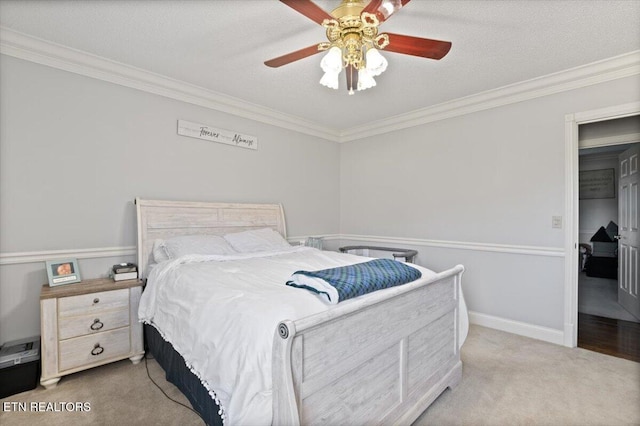 bedroom featuring crown molding, a textured ceiling, and carpet flooring