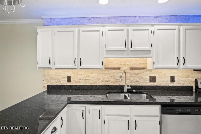 kitchen with tasteful backsplash, white cabinetry, a sink, and stainless steel dishwasher