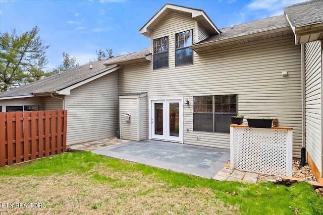 back of house featuring a patio area, fence, and a yard