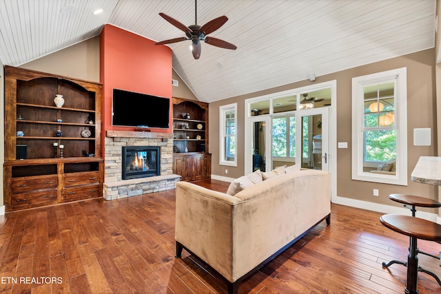 living room featuring baseboards, built in features, a fireplace, high vaulted ceiling, and wood-type flooring