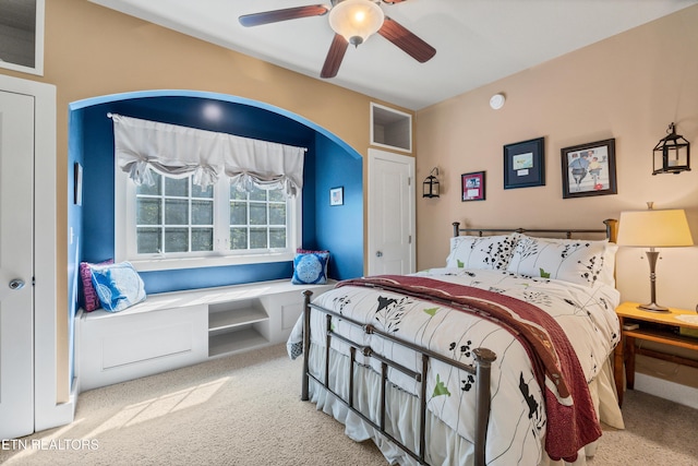 bedroom with a ceiling fan and carpet flooring