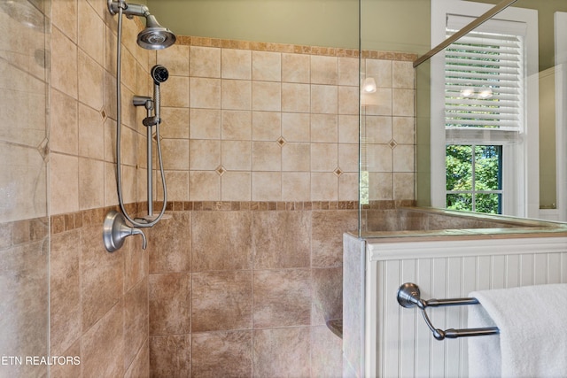 full bathroom with tiled shower