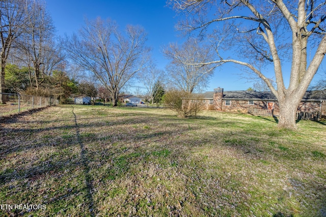 view of yard featuring fence