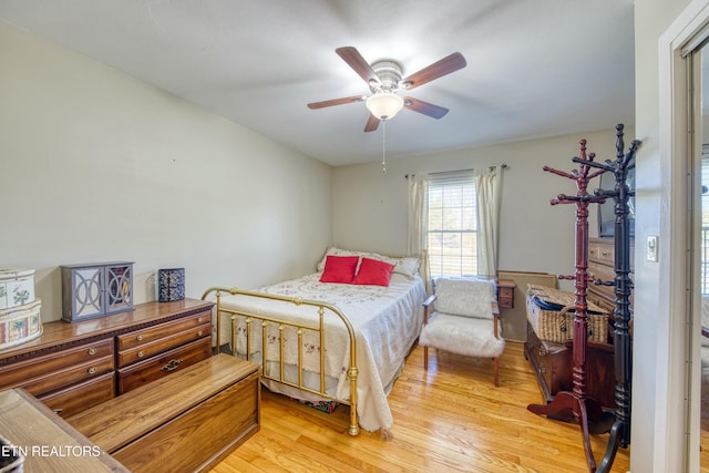 bedroom featuring a ceiling fan and light wood-type flooring