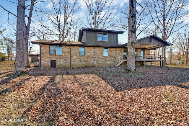 2024 Cravens Dr, Crossville, TN 38572 - rear view of property featuring stairway, brick siding, and covered porch
