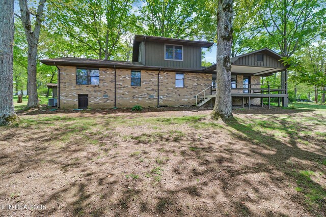 2024 Cravens Dr, Crossville, TN 38572 - back of property featuring brick siding and stairway