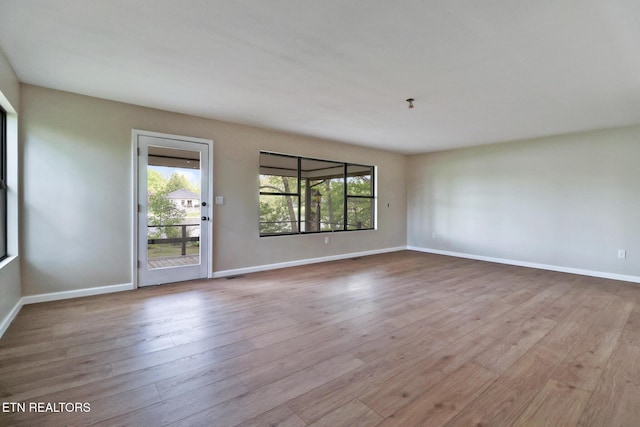 2024 Cravens Dr, Crossville, TN 38572 - spare room with wood finished floors and baseboards