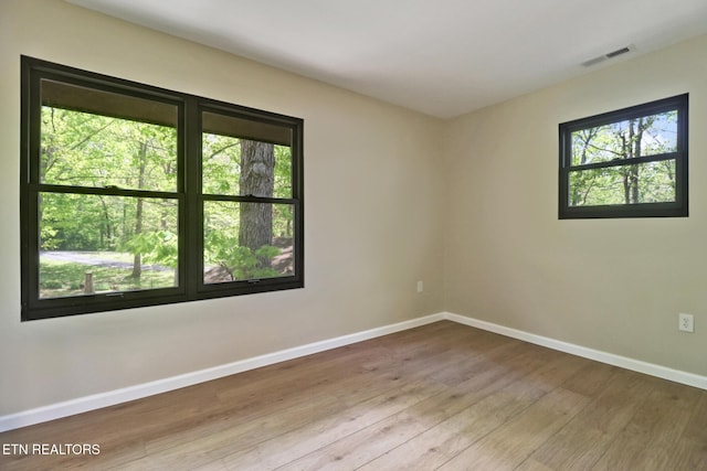 2024 Cravens Dr, Crossville, TN 38572 - unfurnished room featuring healthy amount of natural light, baseboards, and wood finished floors