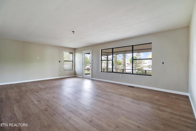 2024 Cravens Dr, Crossville, TN 38572 - unfurnished room with baseboards and wood finished floors