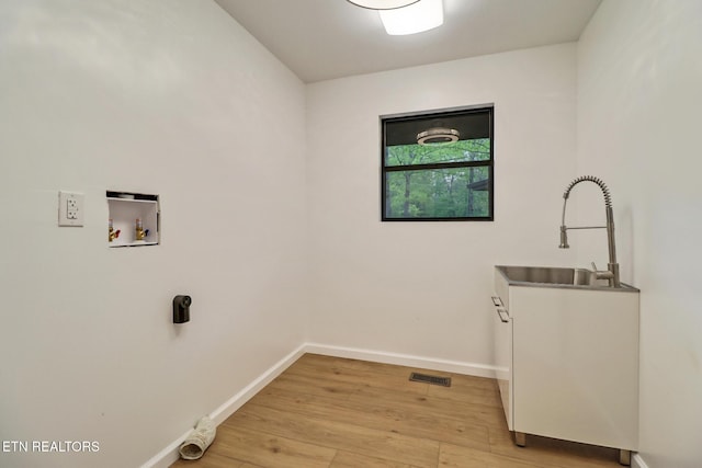 2024 Cravens Dr, Crossville, TN 38572 - clothes washing area with hookup for a washing machine, light wood-style flooring, and baseboards
