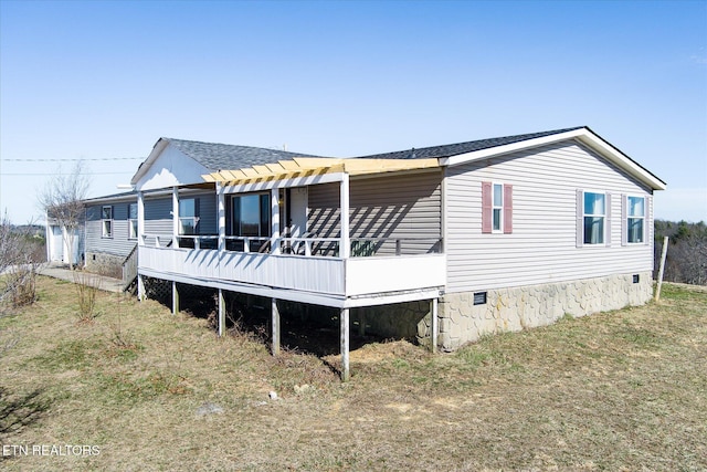 rear view of house with a yard, a shingled roof, crawl space, and a pergola