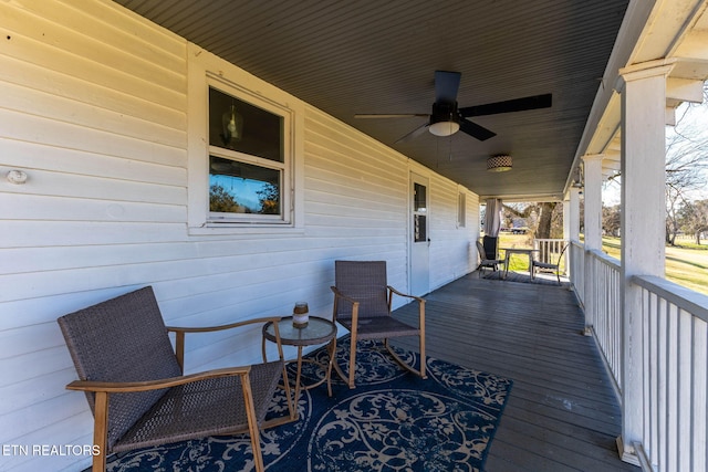 deck featuring a porch and a ceiling fan