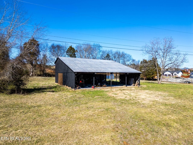 exterior space featuring a carport and a lawn