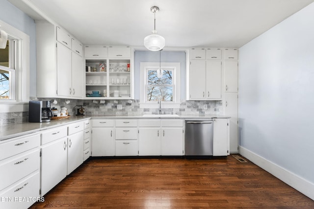 kitchen featuring dark wood-type flooring, a sink, white cabinetry, decorative backsplash, and dishwasher