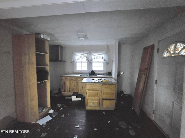 kitchen with brown cabinets and extractor fan