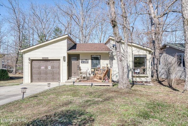 mid-century modern home featuring concrete driveway, a front lawn, roof with shingles, and an attached garage