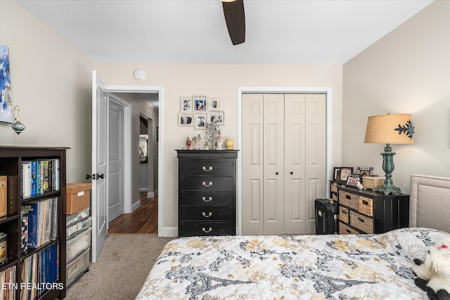 carpeted bedroom with ceiling fan, baseboards, and a closet