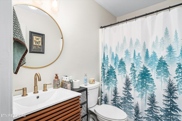 bathroom with a shower with shower curtain, vanity, and toilet