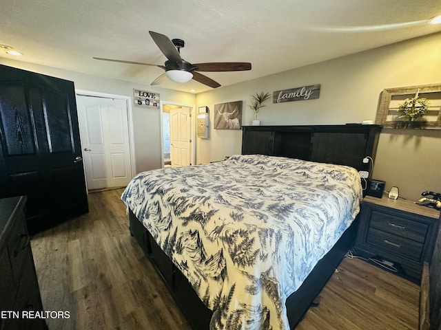 bedroom with ceiling fan and dark wood-type flooring