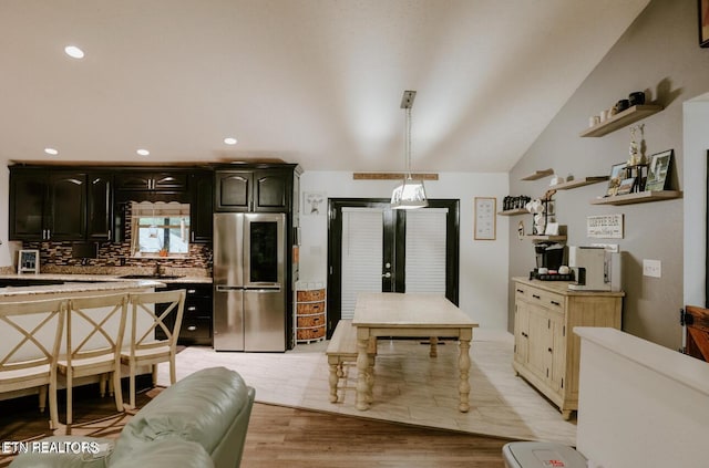 kitchen featuring smart refrigerator, open shelves, and light countertops