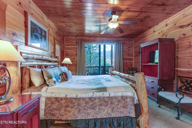 carpeted bedroom featuring wooden ceiling and wooden walls