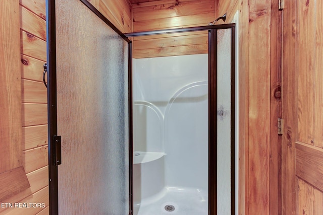 bathroom with a shower stall