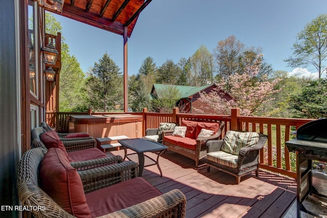 deck featuring an outdoor hangout area and a hot tub