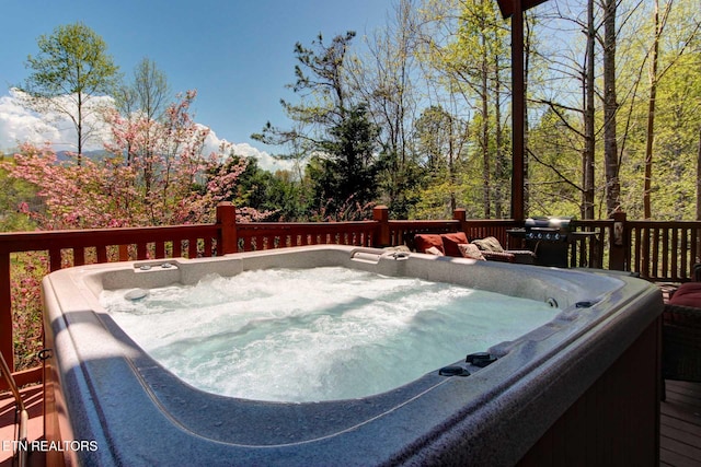 wooden terrace with a hot tub