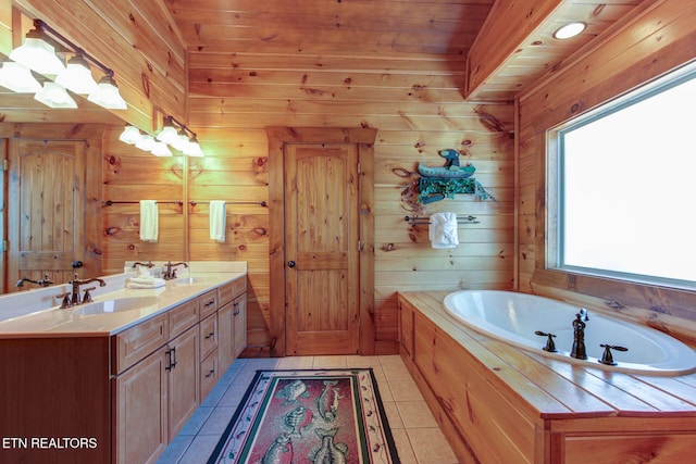 bathroom featuring double vanity, a garden tub, a sink, and tile patterned floors