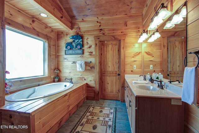 full bathroom featuring double vanity, a garden tub, wood ceiling, and a sink