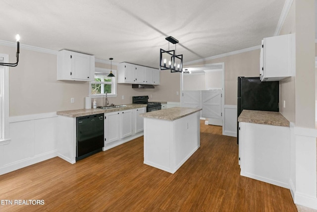 kitchen with black appliances, a kitchen island, white cabinetry, and a sink