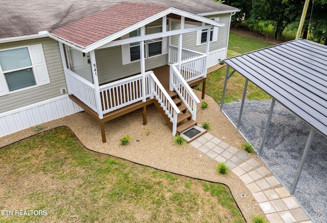 view of front of property featuring covered porch, roof with shingles, and a front lawn