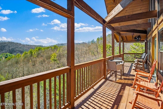 deck featuring a forest view