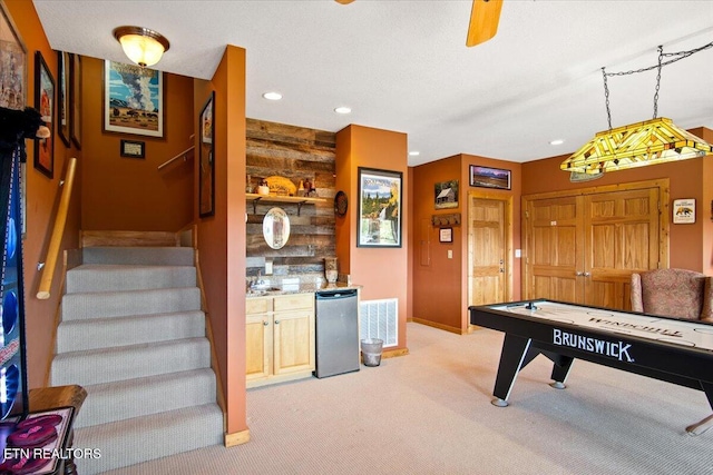 game room featuring light carpet, baseboards, visible vents, a textured ceiling, and recessed lighting