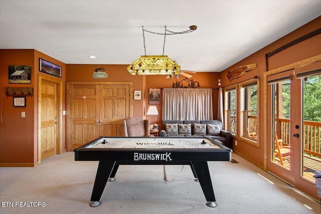 playroom with carpet and baseboards